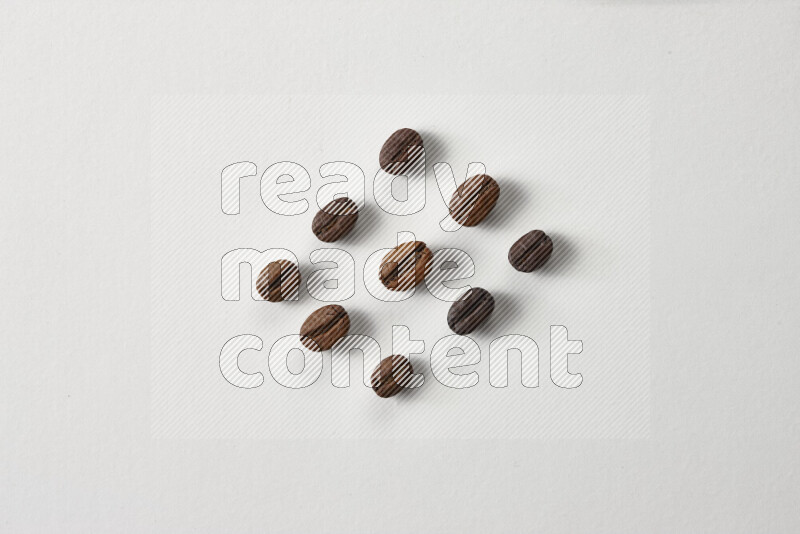 Roasted coffee beans on white background