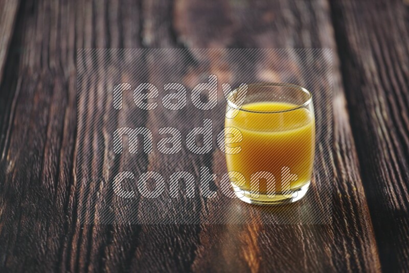 Cold drinks in a glass cup such as water, tamarind, qamar eldin, sobia, milk and hibiscus on wooden background