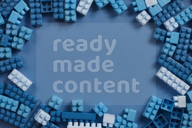 Blue plastic building blocks on blue background (kids toys)