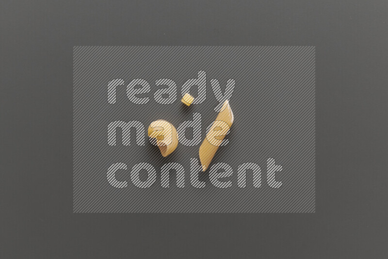 Different pasta types on grey background