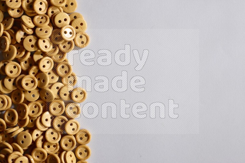 Wooden buttons placed on grey background