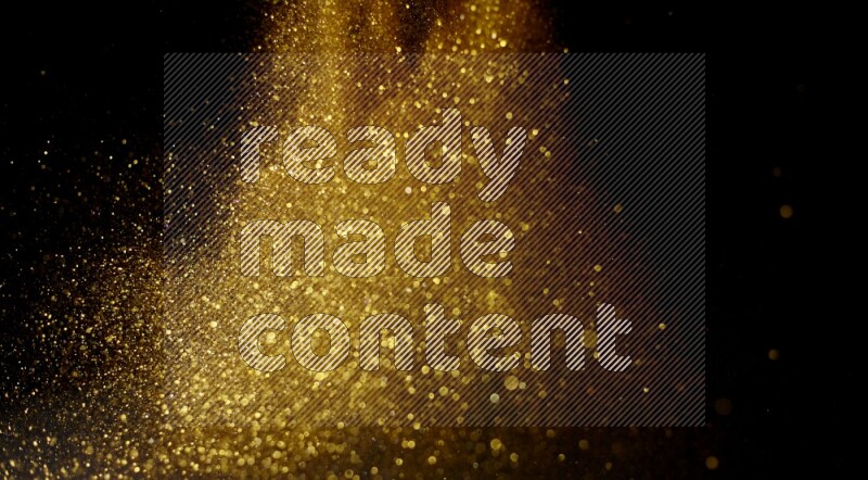 Gold glitter powder isolated on black background