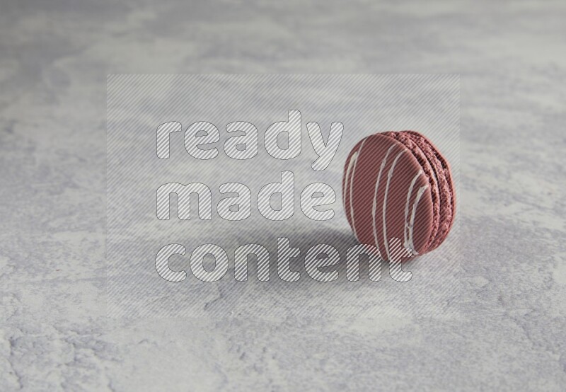 45º Shot of Red Poppy Flower macaron on white  marble background