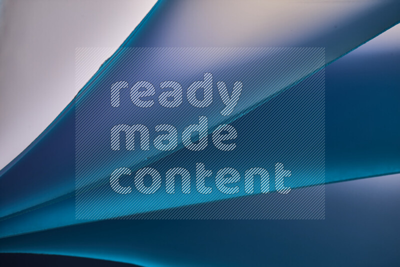 An abstract art piece displaying smooth curves in cold gradients created by colored light