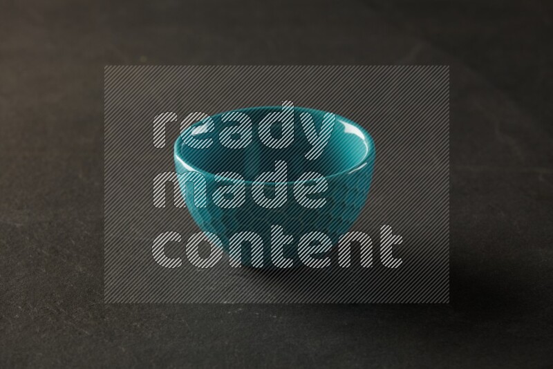 turquoise round bowl on grey textured countertop