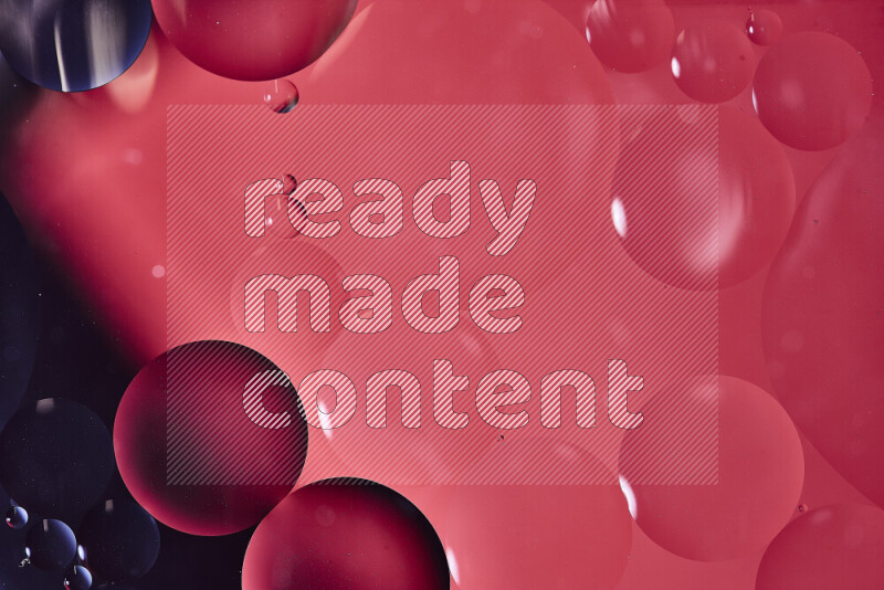 Close-ups of abstract oil bubbles on water surface in shades of black and red