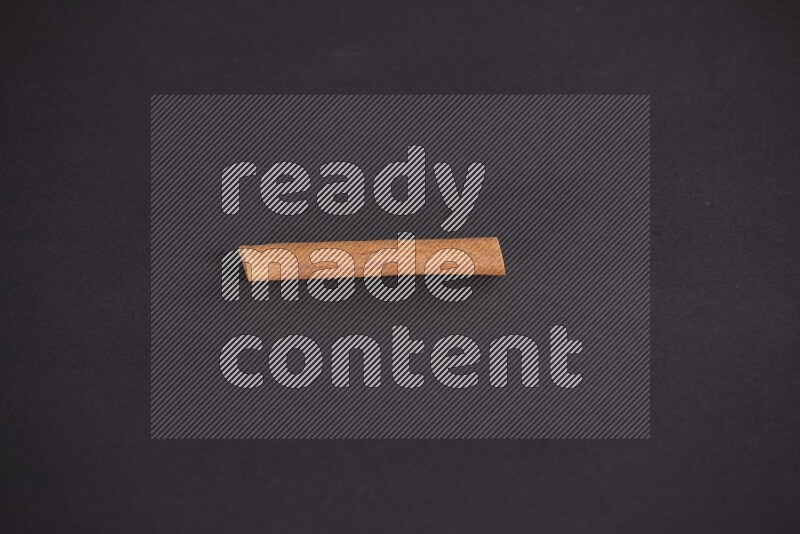Cinnamon stick on black background