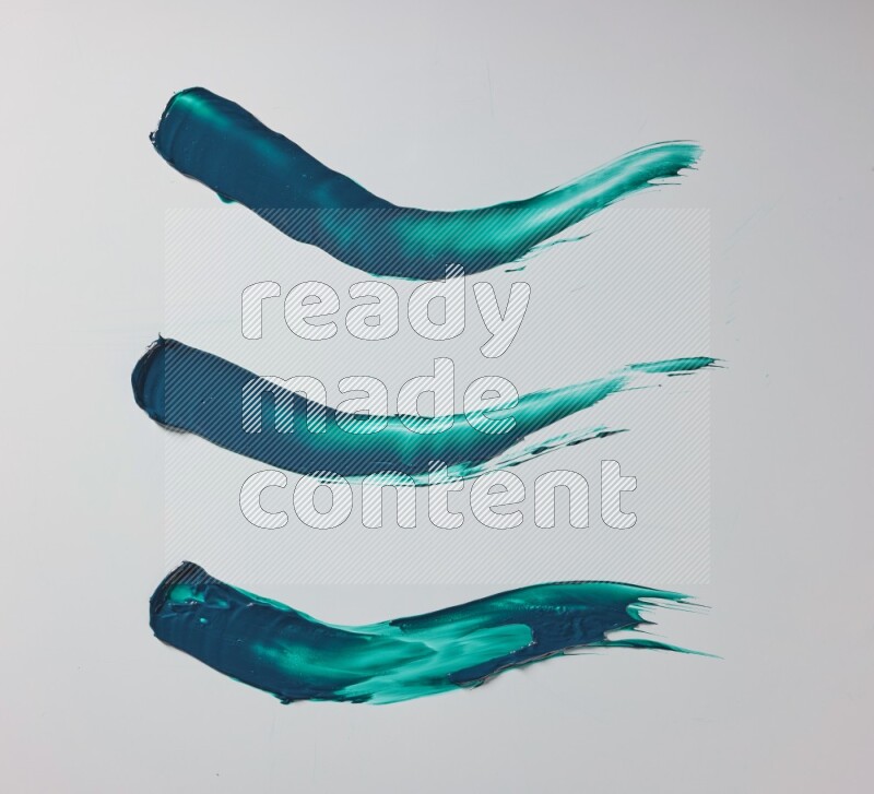 Turquoise painting knife strokes on white background