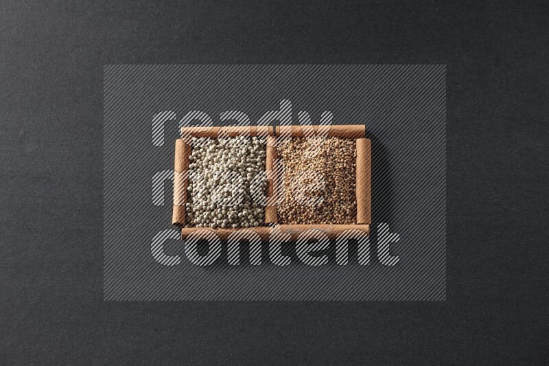 2 squares of cinnamon sticks full of mustard seeds and white peppers on black flooring