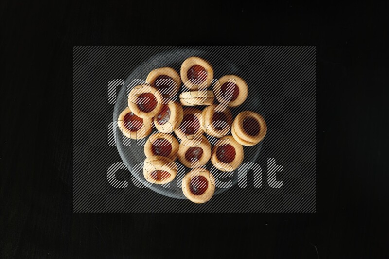 Jam cookies on a black background