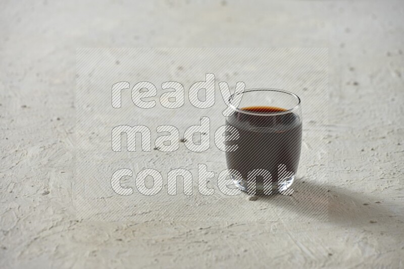 Cold drinks in a glass cup such as water, tamarind, qamar eldin, sobia, milk and hibiscus on textured white background