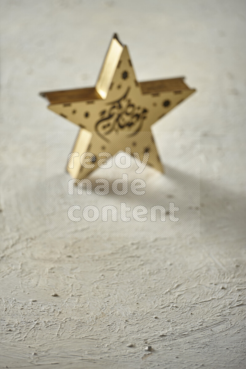 A lantern placed on a textured white background