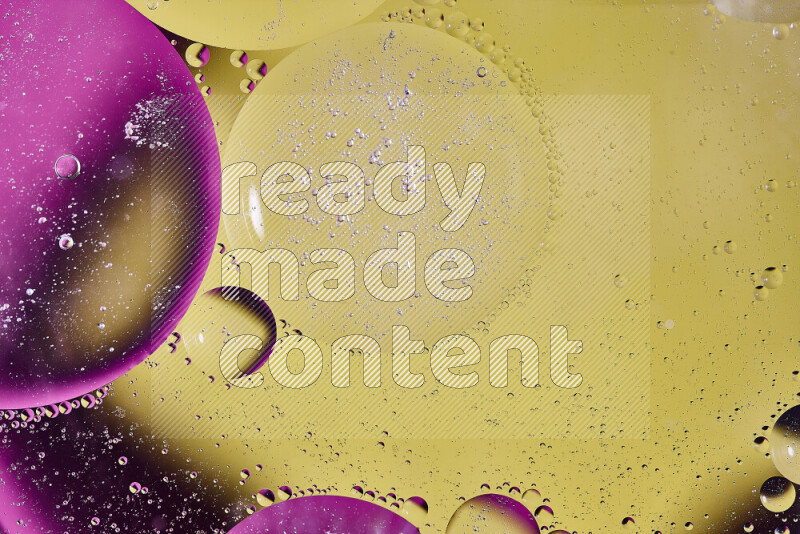 Close-ups of abstract oil bubbles on water surface in shades of yellow and pink