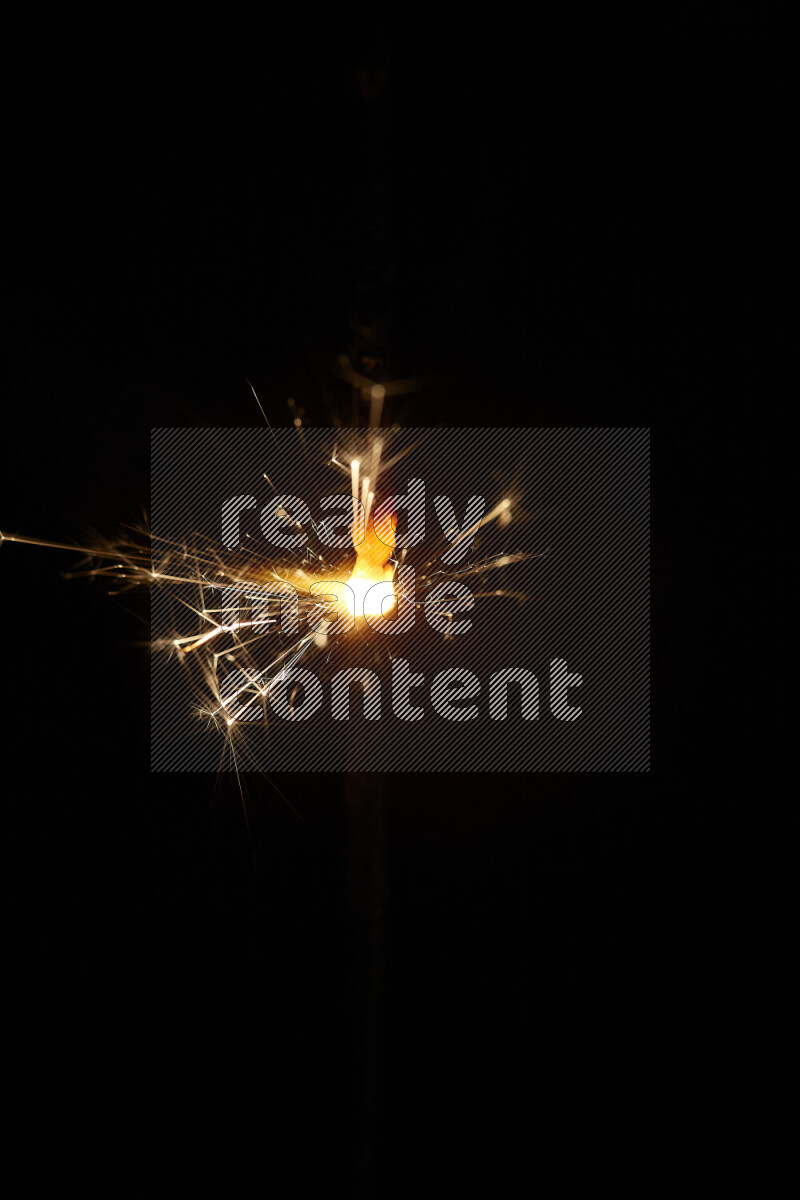 A close-up image of sparkler candle isolated on black background