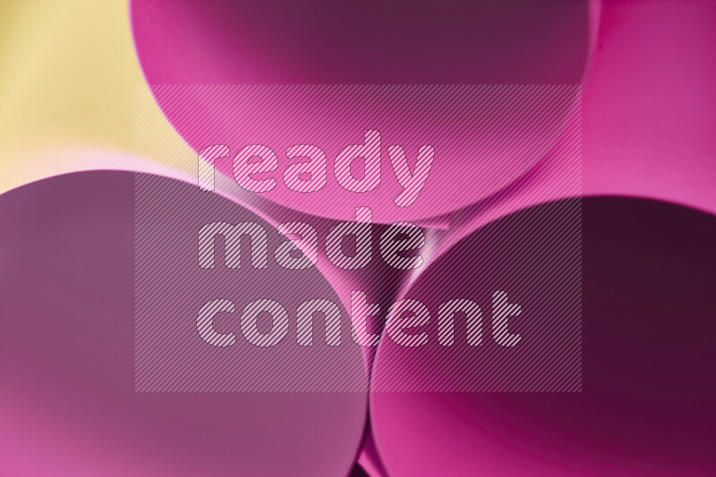 The image shows an abstract paper art with circular shapes in varying shades of pink and warm tones