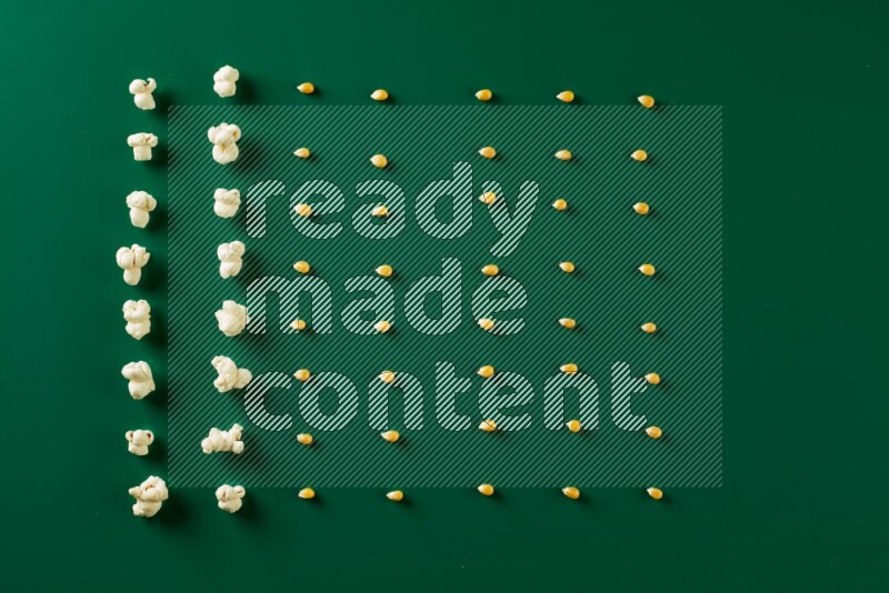 Popcorn flakes and seeds on a green background in a top view shot