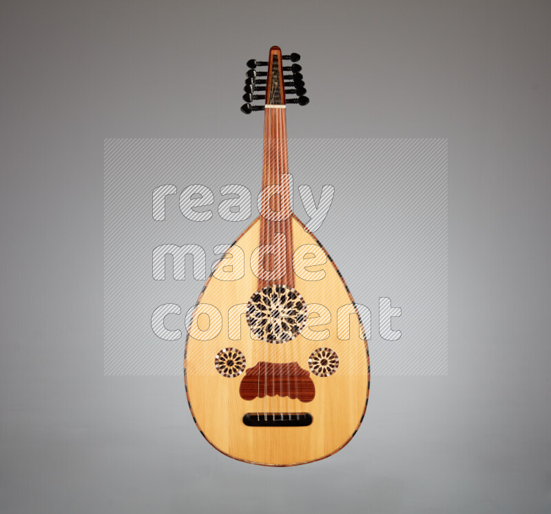 a wooden brown Oud on a gray background