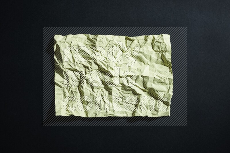 Yellow paper sheet on black background