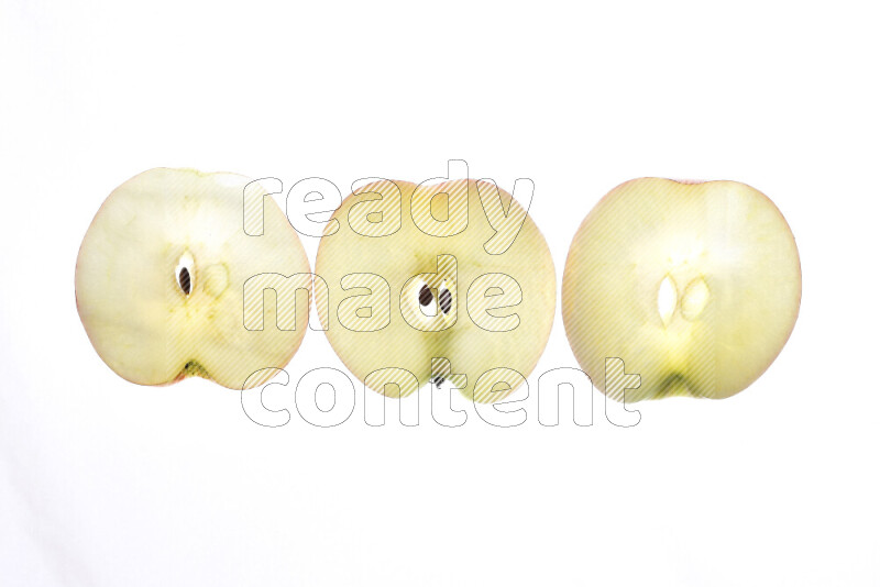Apple slices on illuminated white background