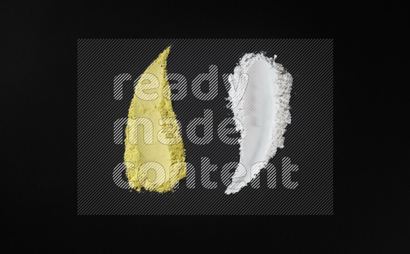 Multicolored powder smears on black background