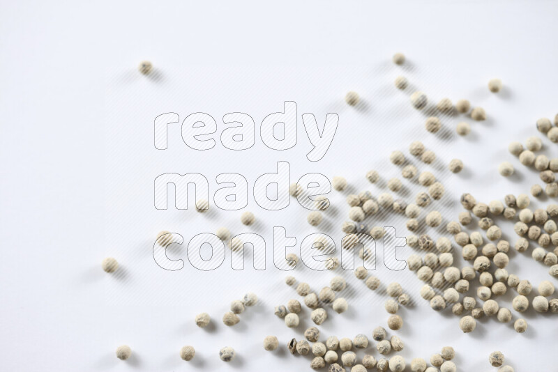 White pepper beads on white background