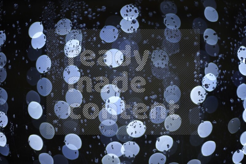 Bokeh light in white with water drops
