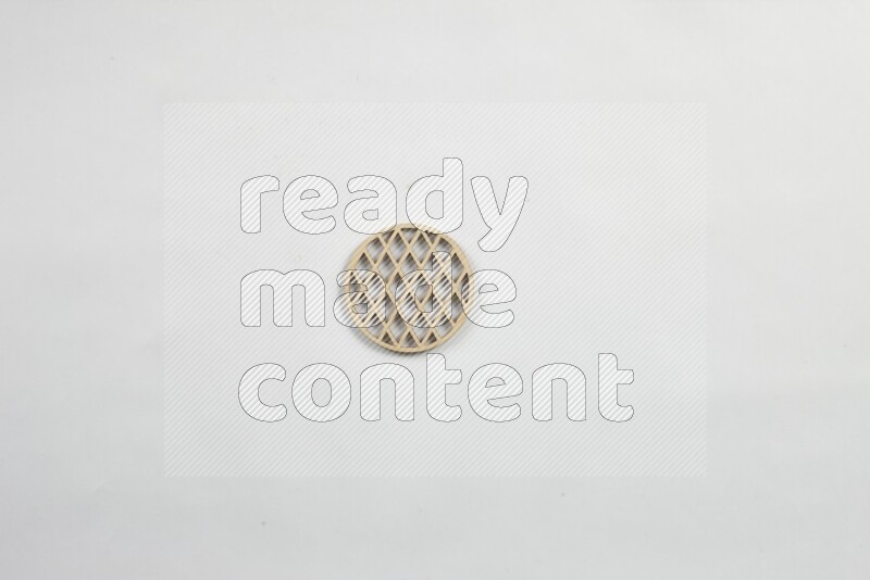 Crafted wooden coasters on white background