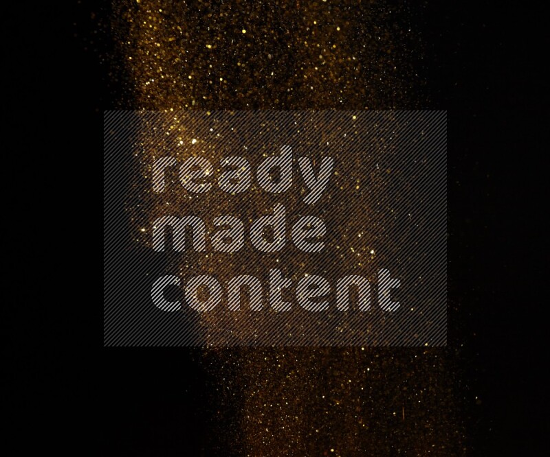 Gold glitter powder isolated on black background