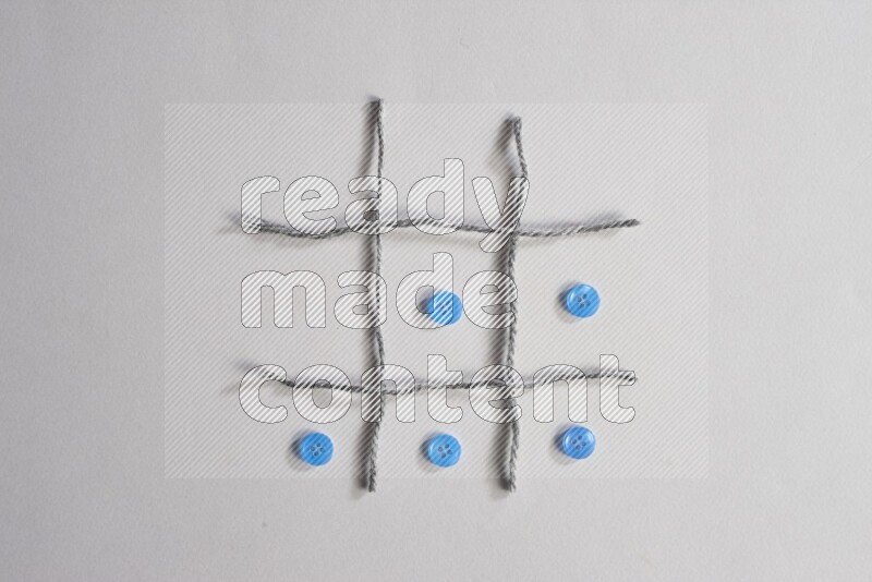 Blue buttons placed on grey background