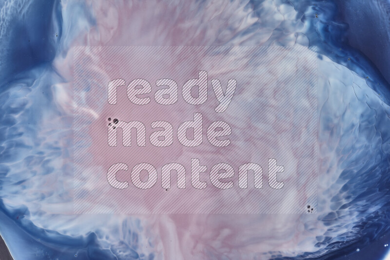 A close-up of abstract swirling patterns in blue, red and white