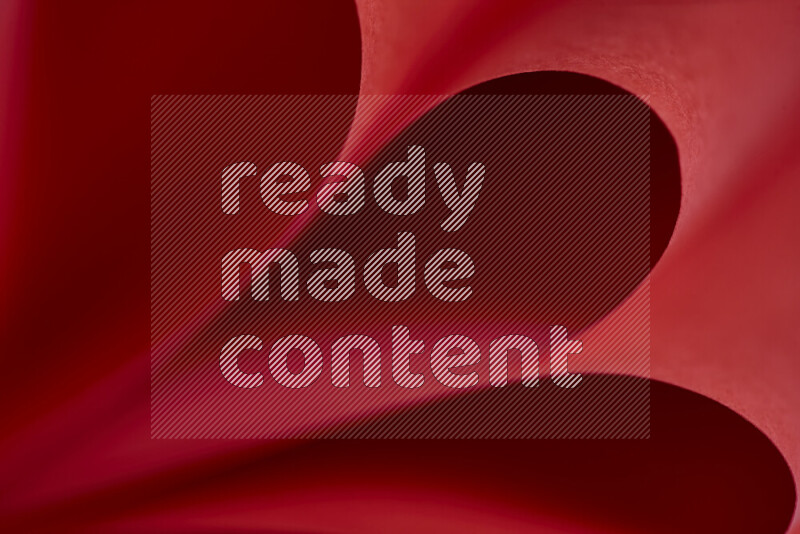 An abstract art showing red paper sheets arranged in an overlapping curves