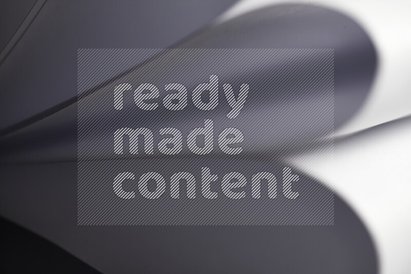 فن تجريدي يعرض المنحنيات المرتبة للأوراق باللون الرمادي