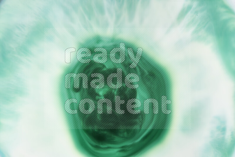 A close-up of abstract swirling patterns in green gradients