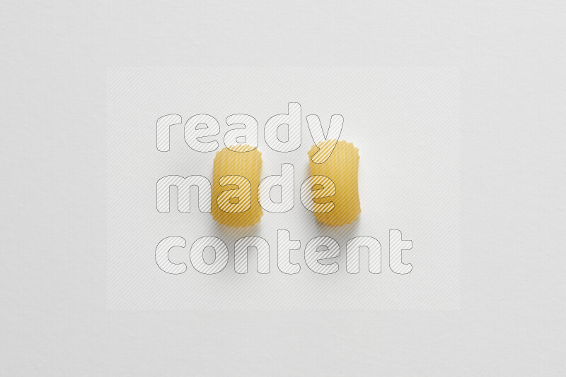 Elbow pasta on white background