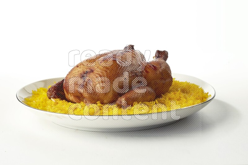 yellow  basmati Rice with kabsa chicken pieces on a white plate with a silver rim direct on white background