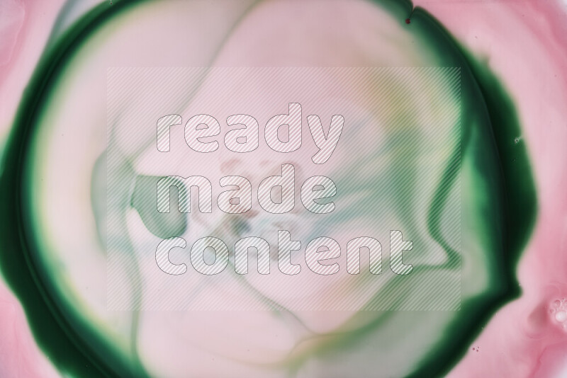 A close-up of abstract swirling patterns in red and green