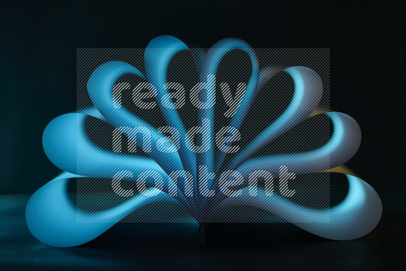 An abstract art piece displaying smooth curves in blue gradients created by colored light
