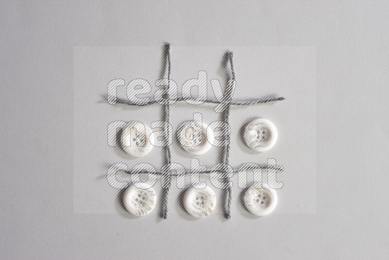 White buttons placed on grey background