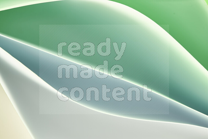 This image showcases an abstract paper art composition with paper curves in green and white gradients created by colored light