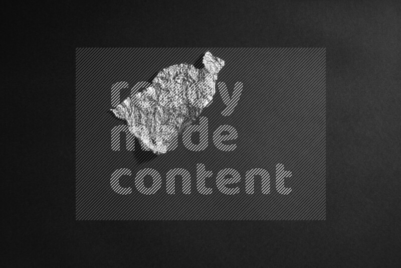 Aluminium foil on black background