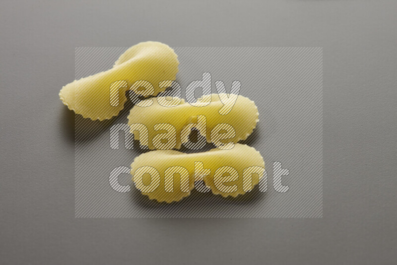 Fiocchi pasta on grey background