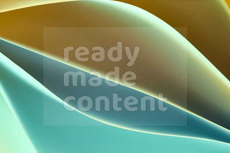 This image showcases an abstract paper art composition with paper curves in green and orange gradients created by colored light