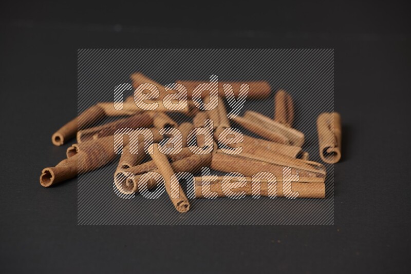 Cinnamon sticks on black background