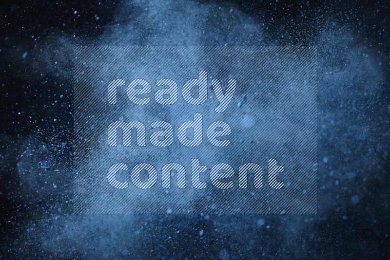 Blue powder explosion on black background