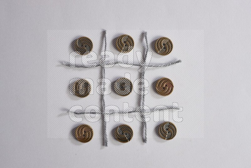 Metal buttons placed on grey background