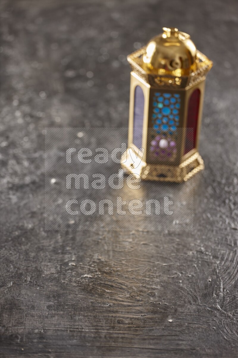 An out of focus lantern on textured black background