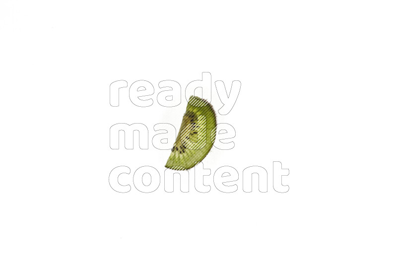 Kiwi slices on illuminated white background