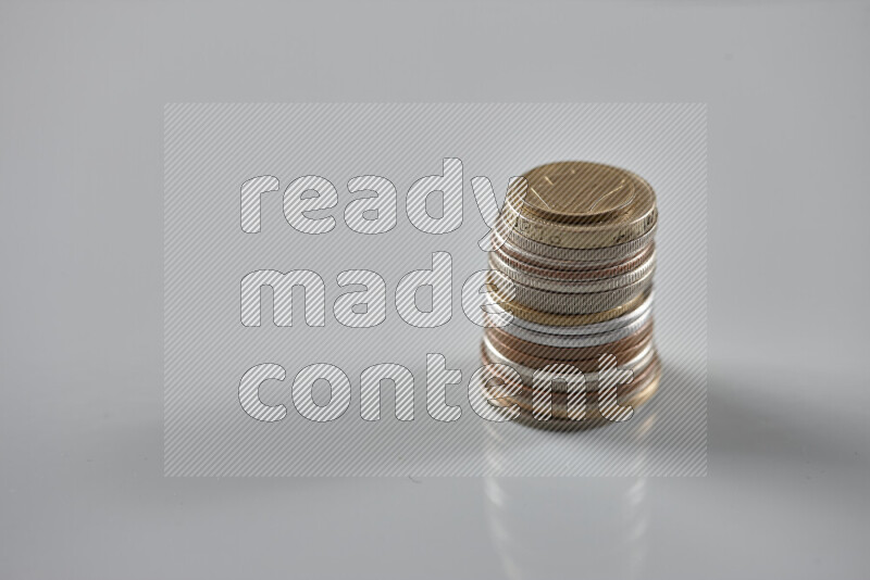 Random old coins on grey background