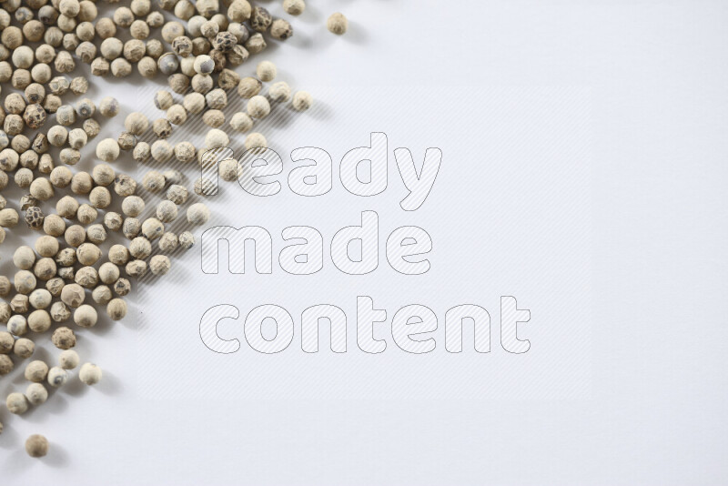 White pepper beads on white background
