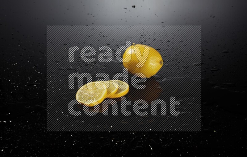 Lemon slices with water drops, and droplets on black background